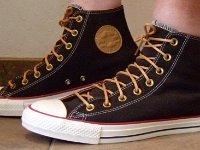 Black and Biscuit High Top Chucks  Wearing black and biscuit high top chucks, left side view 1.